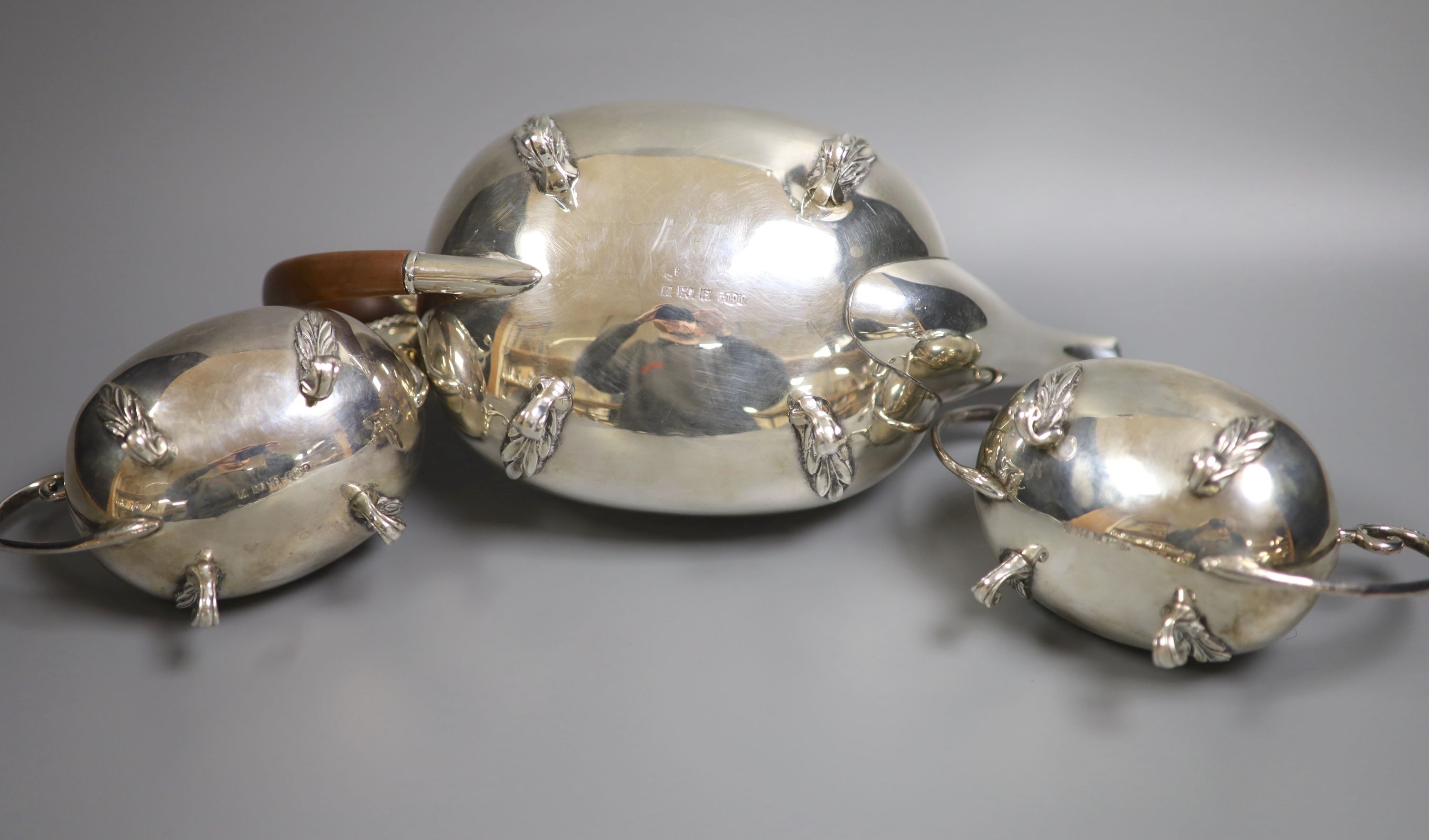 A modern silver three piece tea set by Joseph Gloster Ltd, Birmingham, 1974, gross weight 33oz and a pair of plated sugar tongs.